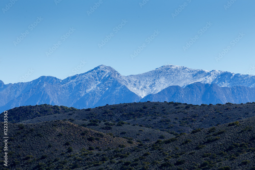 Fototapeta premium Green Landscape with snow on the Swartberg Mountain Range