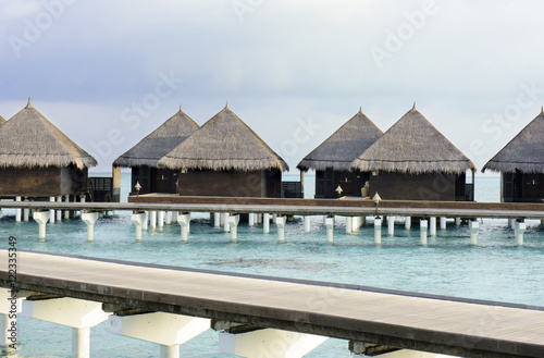 houses on piles on sea. Maldives © senai aksoy
