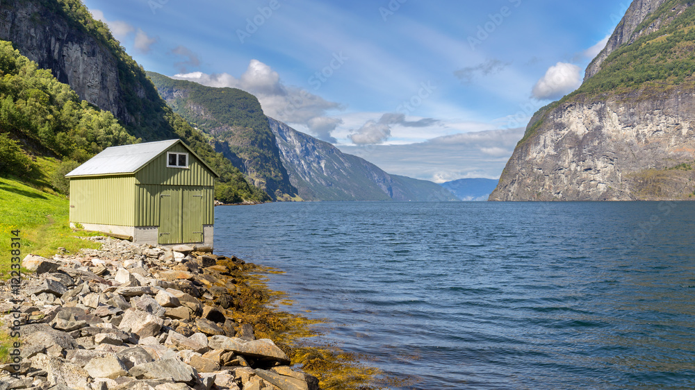 Small hut in Undredal with the fjord in the background, Norway