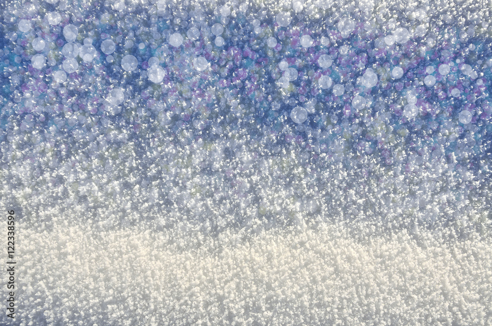 Crystal texture of the snow surface with colorful bokeh Crystal texture of the snow surface with colorful bokeh