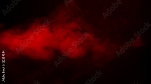 A few bursts of red smoke jetting out from right to left over black background. HD 1080. photo