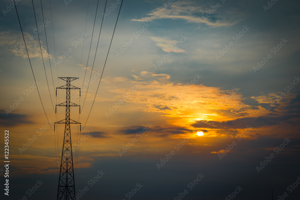 Silhouettes Electricity transmission line and tower during sunset
