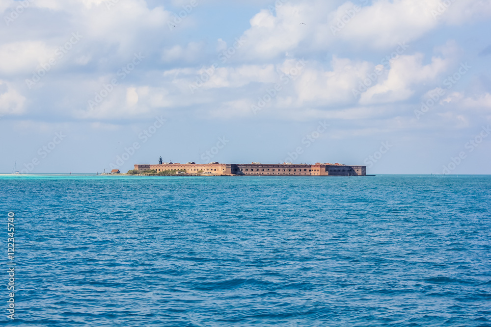Dry Tortugas National Park is 70 miles from Key West in Florida and can be reached by ferry or seaplane. View of Fort Jefferson, a historical military fortress in Garden Key, from the boat ferry.