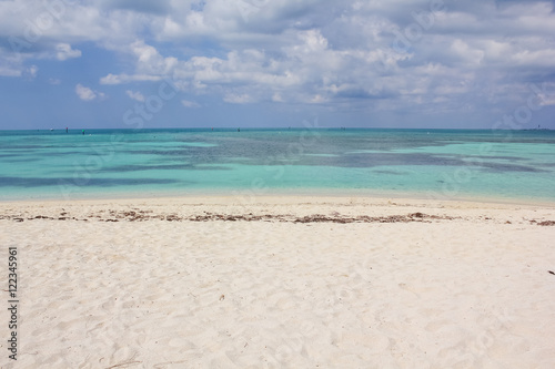 Tropical blue waters, coral reefs and white sand beach in Dry Tortugas National Park.The Dry Tortugas are a small group of islands, located in the Gulf of Mexico at the end of the Florida Keys.