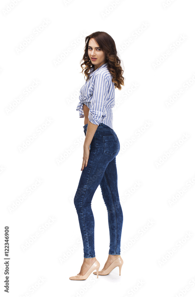 Young beautiful brunette woman in blue jeans Young beautiful brunette woman in blue jeans