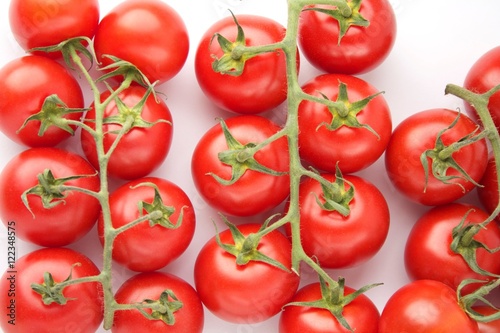 Fresh tomatoes on white background © smalldreamfactory