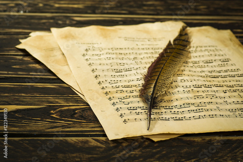 Old music sheet and a quill