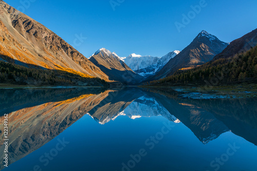 The Mountain Belukha in the reflection Akkem lake at sunset. Altai Mountains, Russia. photo