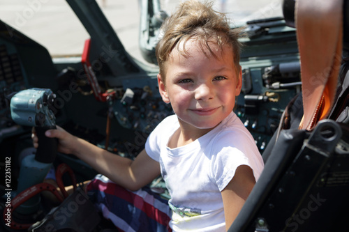 Child in fighter cockpit
