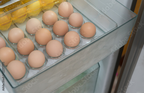 fresh eggs in a shelf of refrigerator