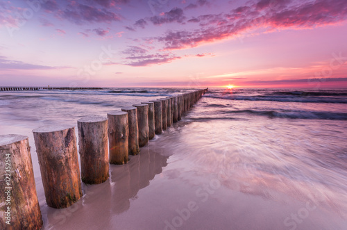 Wooden breakwater - Baltic seascape at sunset, Poland photo