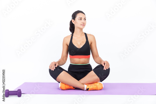 Girl meditating on mat