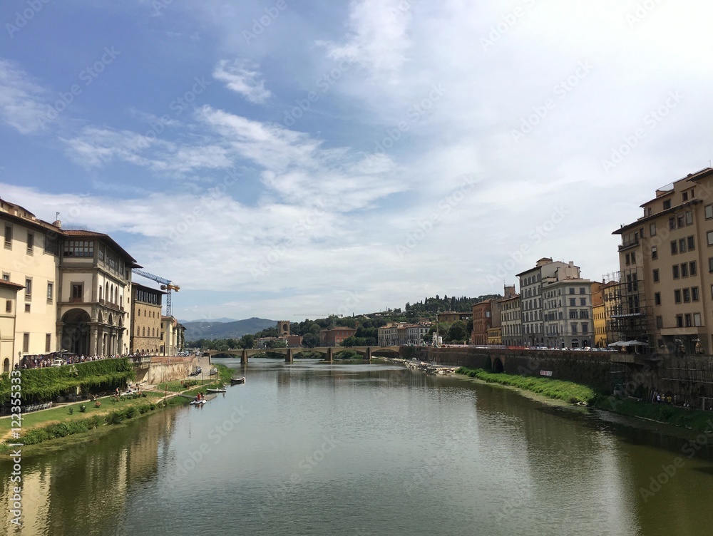 view of the riverside in Florence, italia, from the Ponte Vecchio 