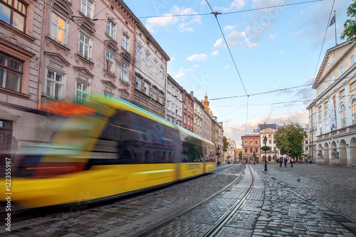 yellow tram rides on the morning old european city.vintage 