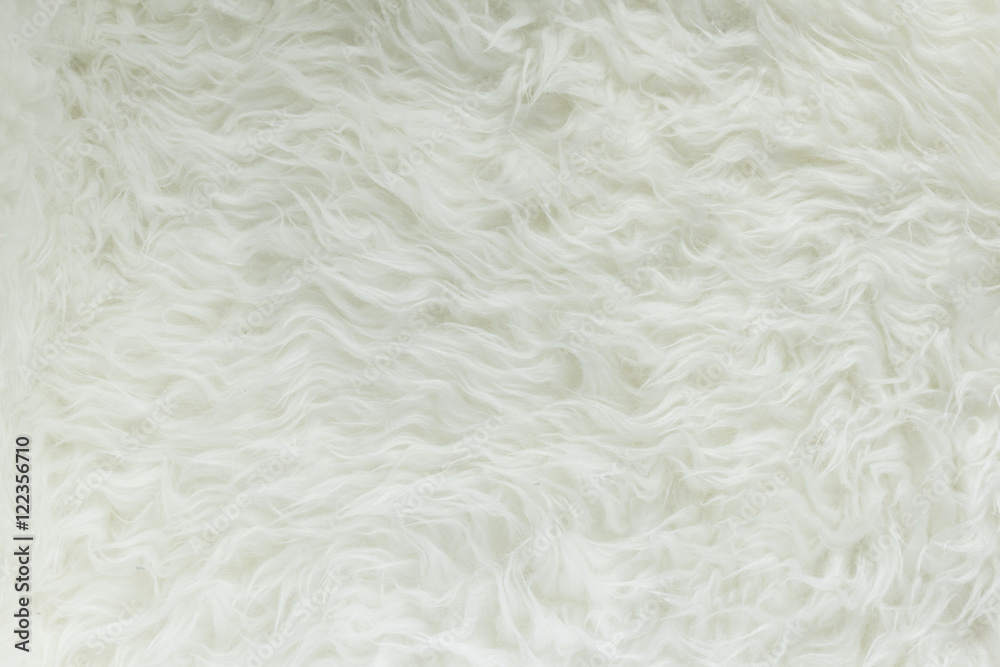 Christmas baubles on white fur and colorful lights. The texture of the white fur with the New 2016-2017 year, Christmas. Christmas baubles on white fur and colorful lights. The texture of the white fur with the New 2016-2017 year, Christmas.