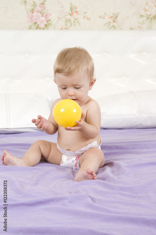 Child plays with a ball Child plays with a ball