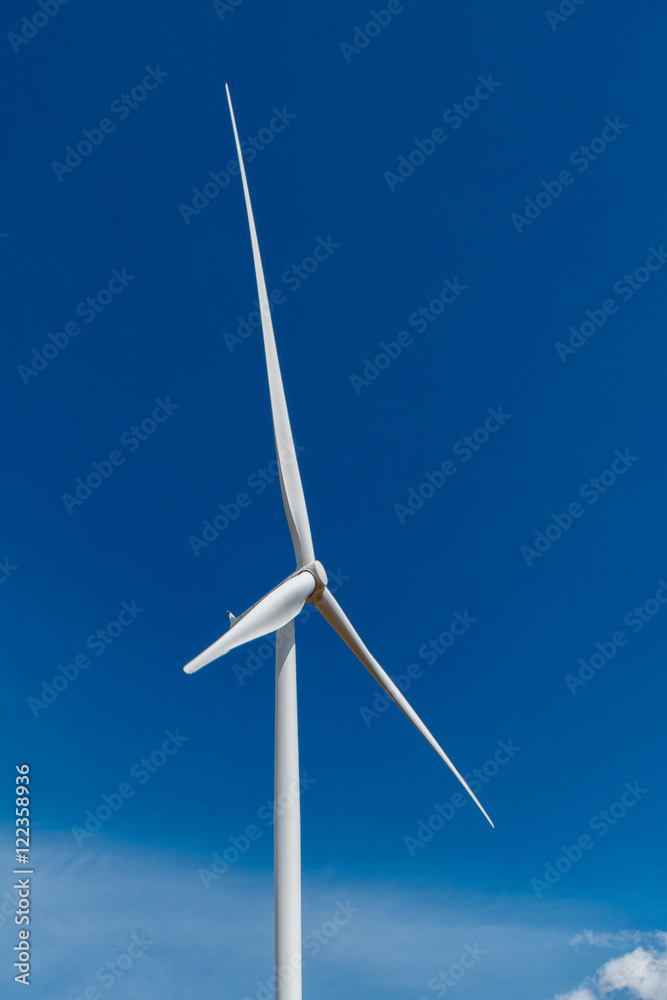 Wind turbine and blue sky background. Wind turbine and blue sky background.