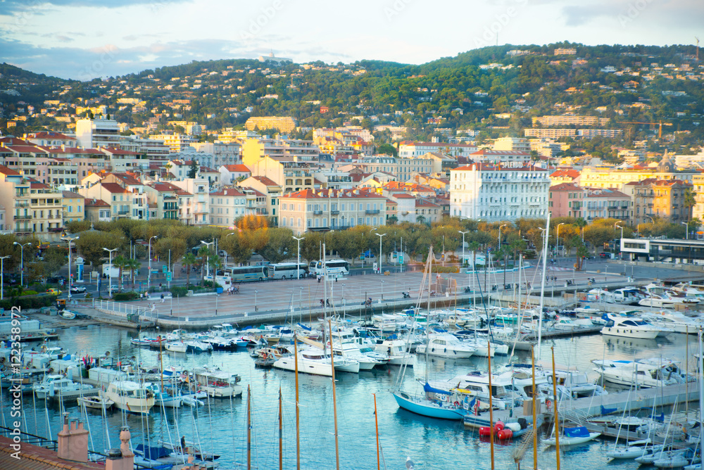 CANNES, FRANCE - 19 SEPTEMBER, 2016: Vieux Port (old port) in the city of Cannes, with lots of sailing boats and power yachts anchored during the Sailing regatta
