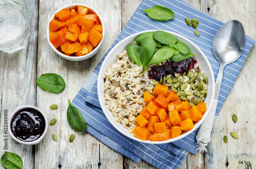 rice bowl with spinach, pumpkin, pumpkin seeds and cranberry sau rice bowl with spinach, pumpkin, pumpkin seeds and cranberry sau