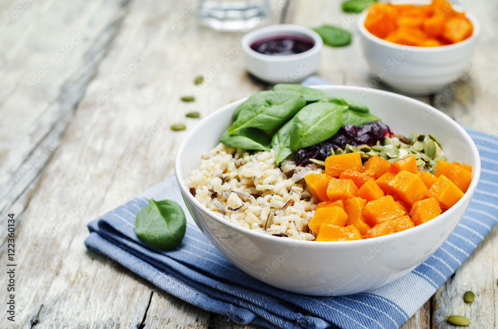 rice bowl with spinach, pumpkin, pumpkin seeds and cranberry sau rice bowl with spinach, pumpkin, pumpkin seeds and cranberry sau