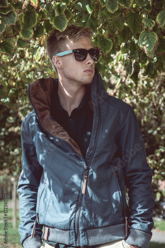 Fashion outdoor photo of stylish handsome man