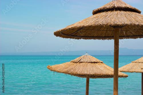 Straw sunshades on the beach