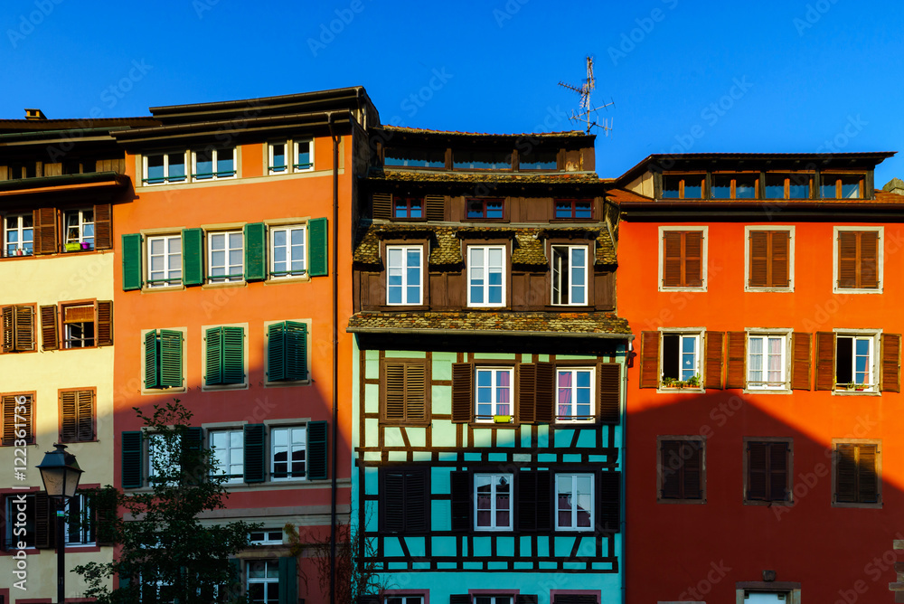 Classic colorized timber-framed alsacien houses in the street of