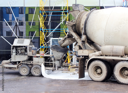 Obraz na plátně concrete pump and  mixer to work together  pouring cement floors in the shopping center for repair