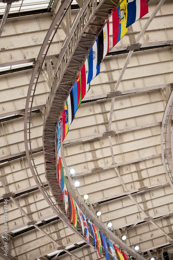 Fototapeta premium national flags under the arch of the stadium