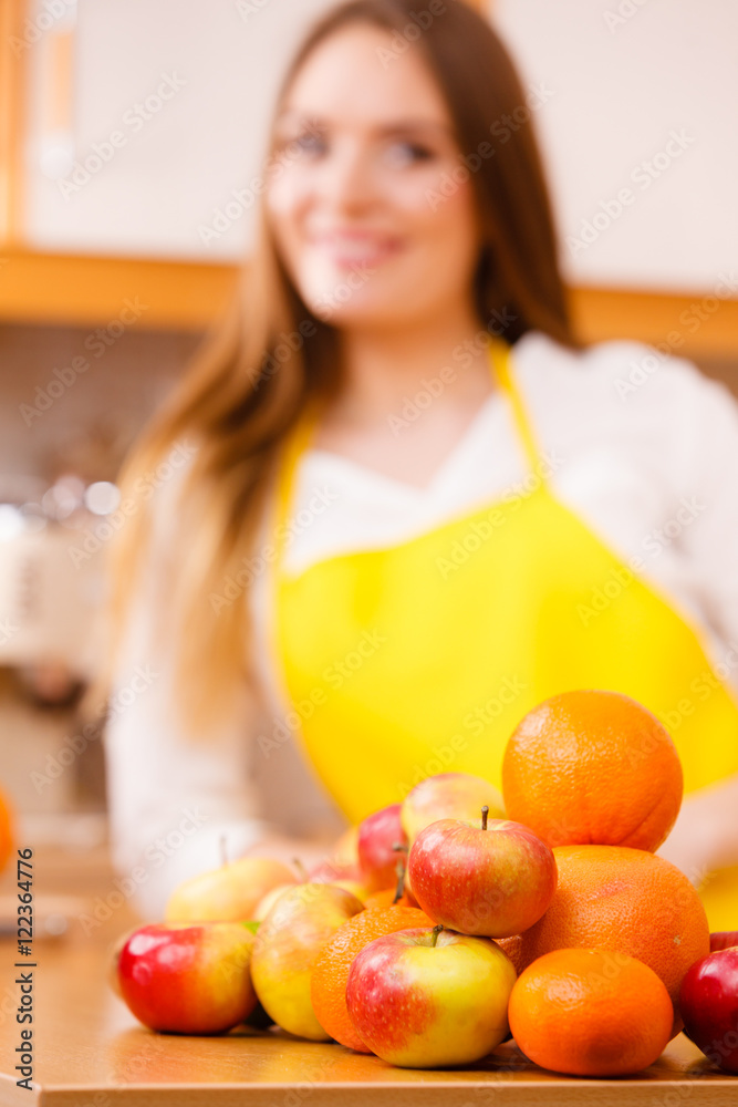 Female cook working in kitchen. Female cook working in kitchen.