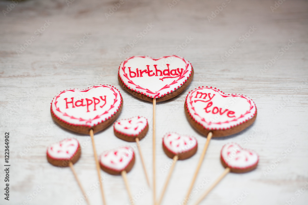 Fototapeta premium Funny and colorful gingerbread shapes on sticks.Happy Birthday