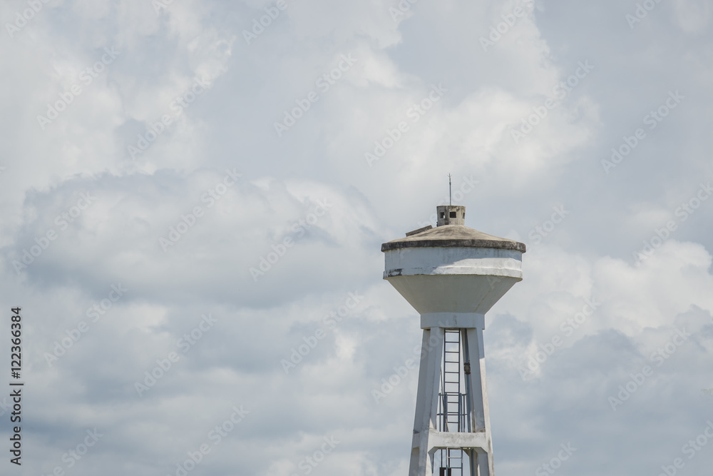 water Tower under white cloudy skies water Tower under white cloudy skies