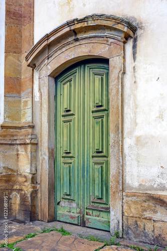 Old and aged wooden church door with beautiful colors and texture in Ouro Preto city