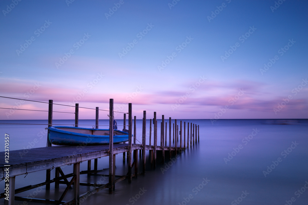 Boat and Pier in Twilight