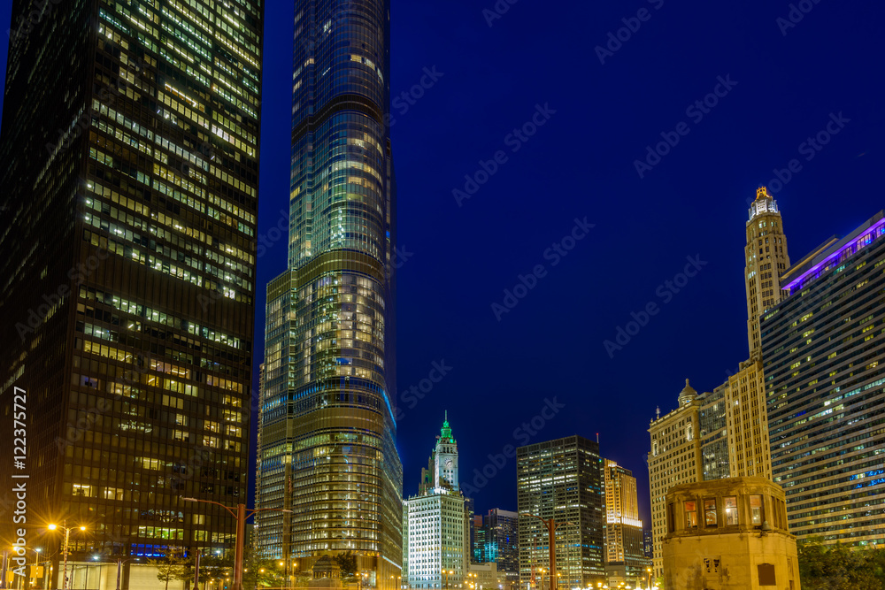 Chicago River skyline with urban skyscrapers at night, IL, USA Chicago River skyline with urban skyscrapers at night, IL, USA