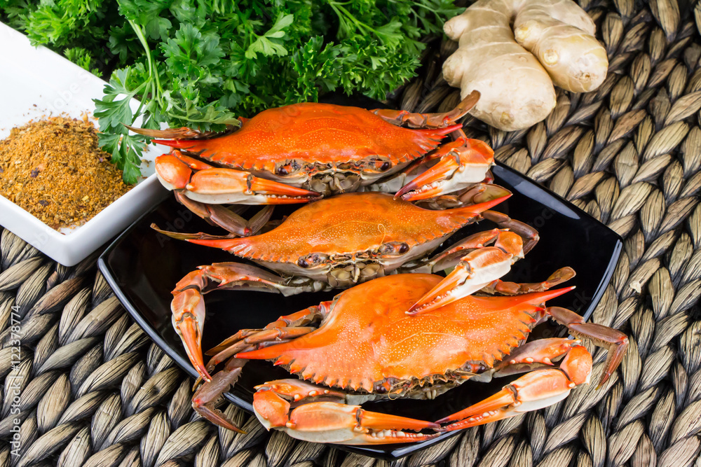 Steamed crabs with spices. Maryland blue crabs. Hot steamed blue crabs with ginger. Crab