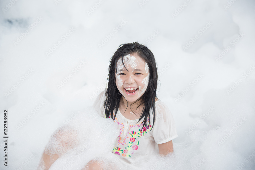 asian girl smiling in foam party asian girl smiling in foam party