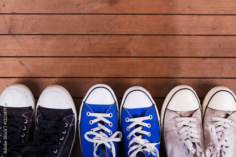 Old canvas shoes on a wooden floor