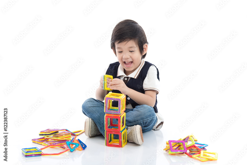 child playing with lots of colorful plastic blocks kit child playing with lots of colorful plastic blocks kit