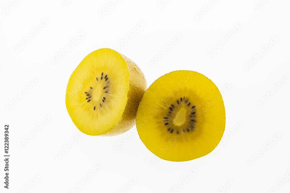 Kiwi slices into half on white background Kiwi slices into half on white background