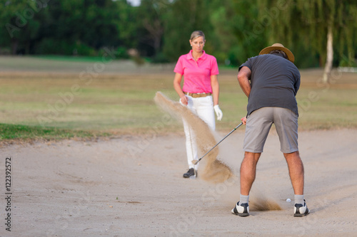 Couple Enjoying A Game Of Golf © eric