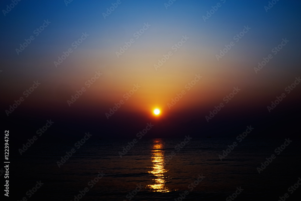 blurred sunrise and sea for background