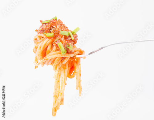 Spaghetti bolognese being eaten with a fork