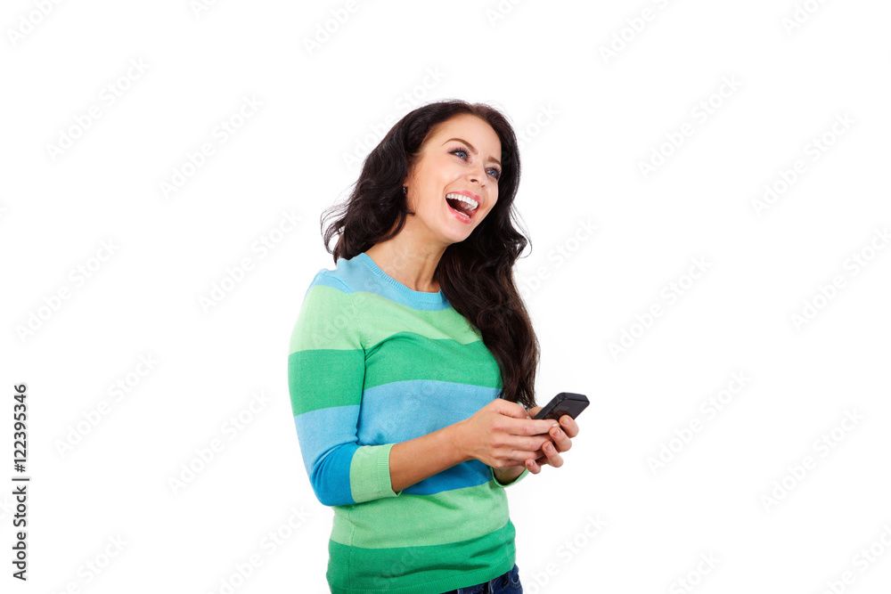 Cheerful woman holding smart phone against white background Cheerful woman holding smart phone against white background