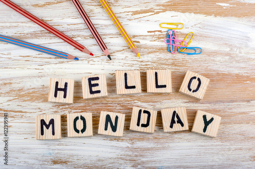 Text: Hello Monday from wooden letterson on wooden background photo