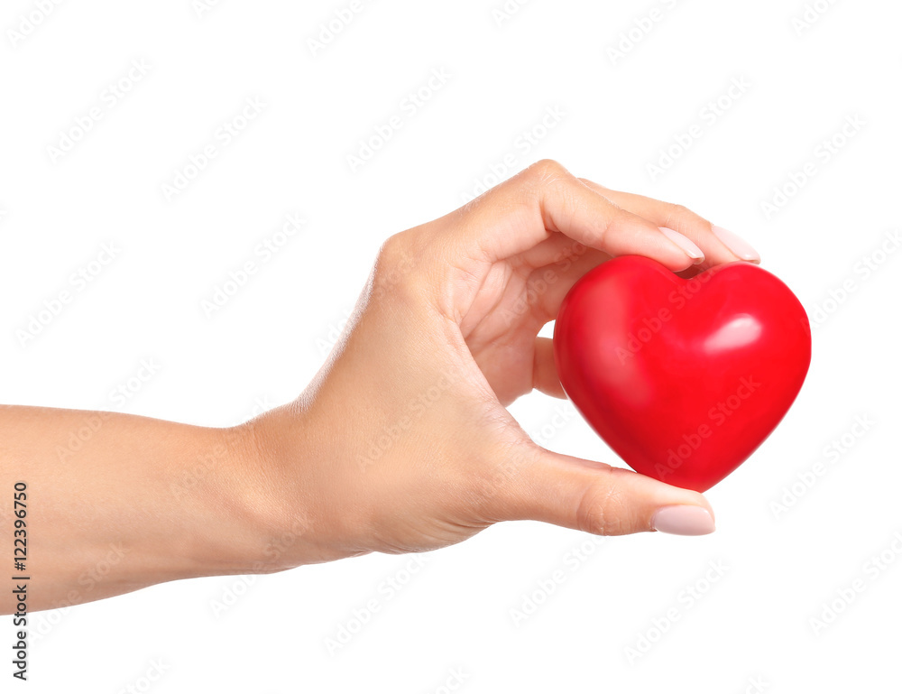 Obraz premium Female hand with red heart isolated on white