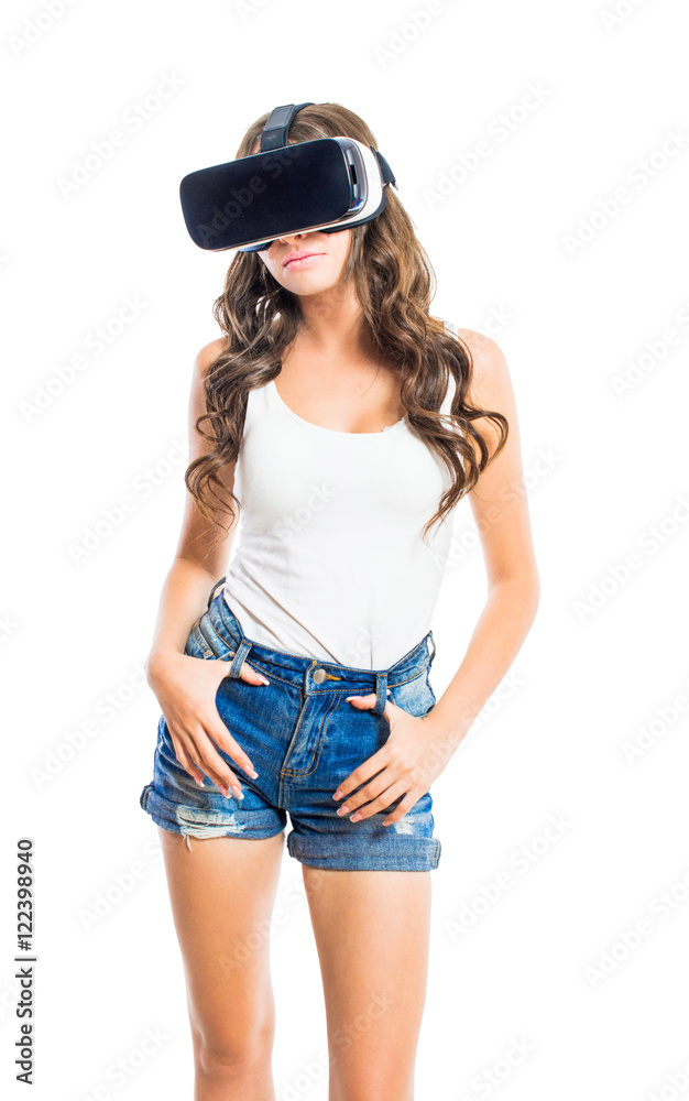 Young sexy girl with glasses of virtual reality in different poses isolated on white background. Young sexy girl with glasses of virtual reality in different poses isolated on white background.