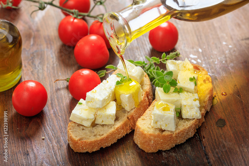 Feta cheece pieces on wooden background