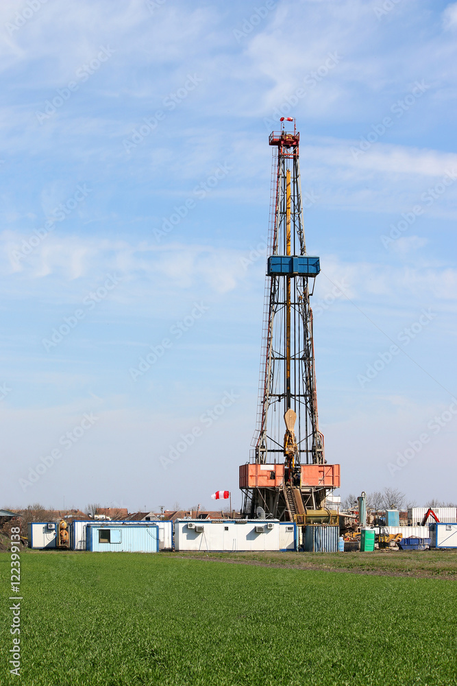 Land oil drilling rig on green field Land oil drilling rig on green field
