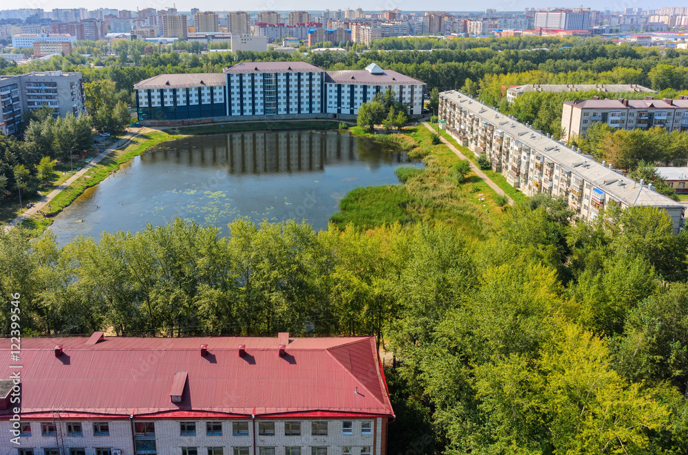 Tyumen, Russia - August 18, 2016: Aerial view onto Office building on Pond Duck and residential houses